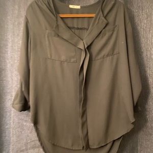 Black blouse size small, sleeves are scrunched up. Slightly high low